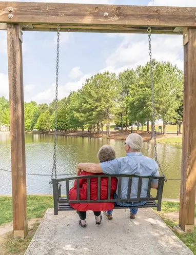 Main Street Financial Partners - Retirement Planning Services with couple on swing